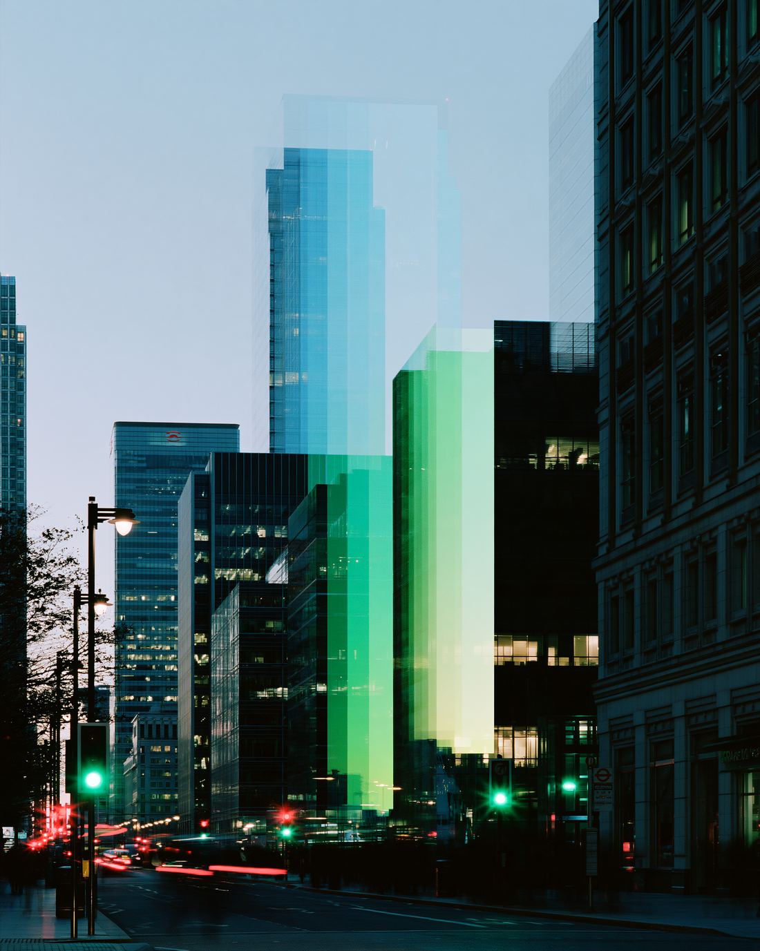 Glass towers lit in green and blue