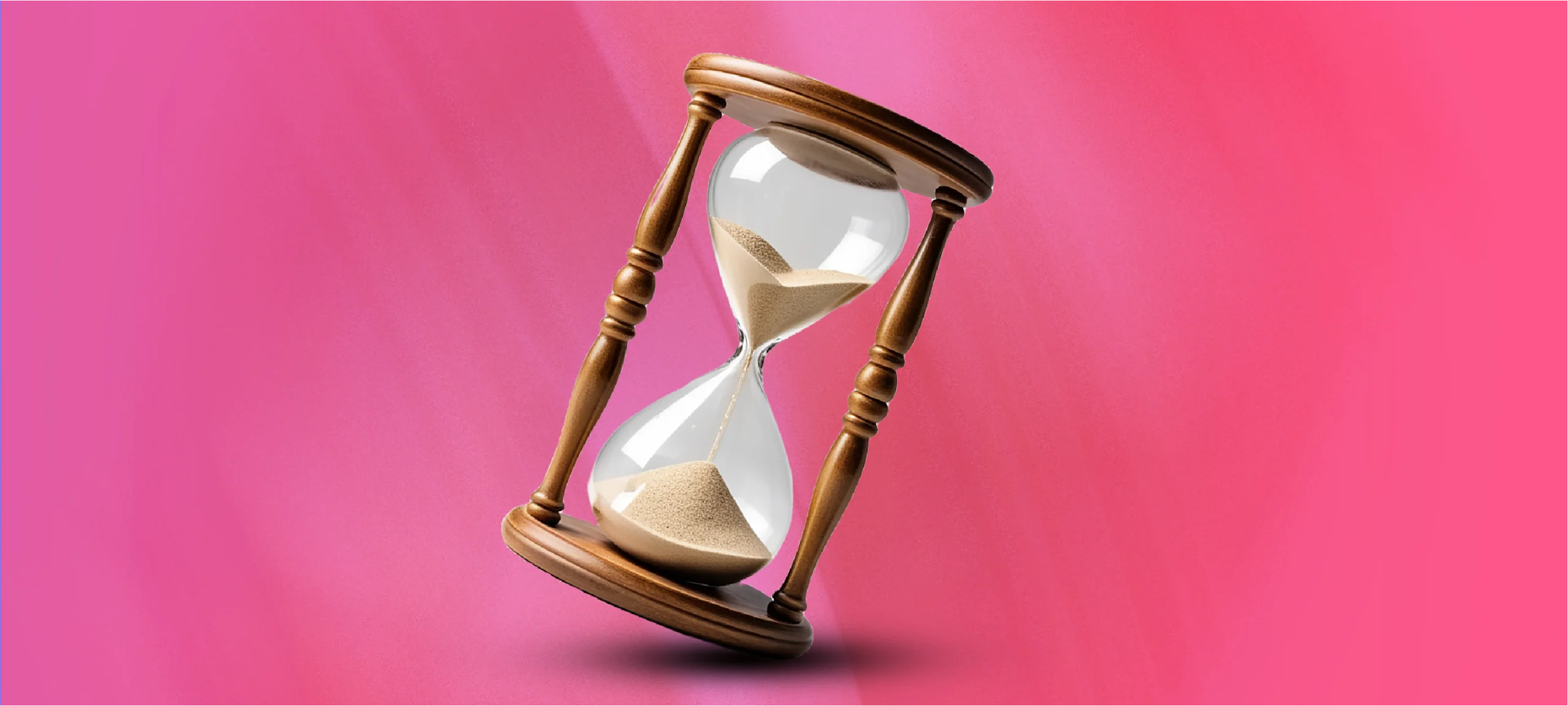 Hourglass symbolising wasted time and delays from broken delivery models.